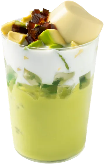 Avocado Dessert: creamy green avocado layer with avocado chunks and coconut cream, topped with a creamy yellow piece, avocado pieces and dark jelly cubes